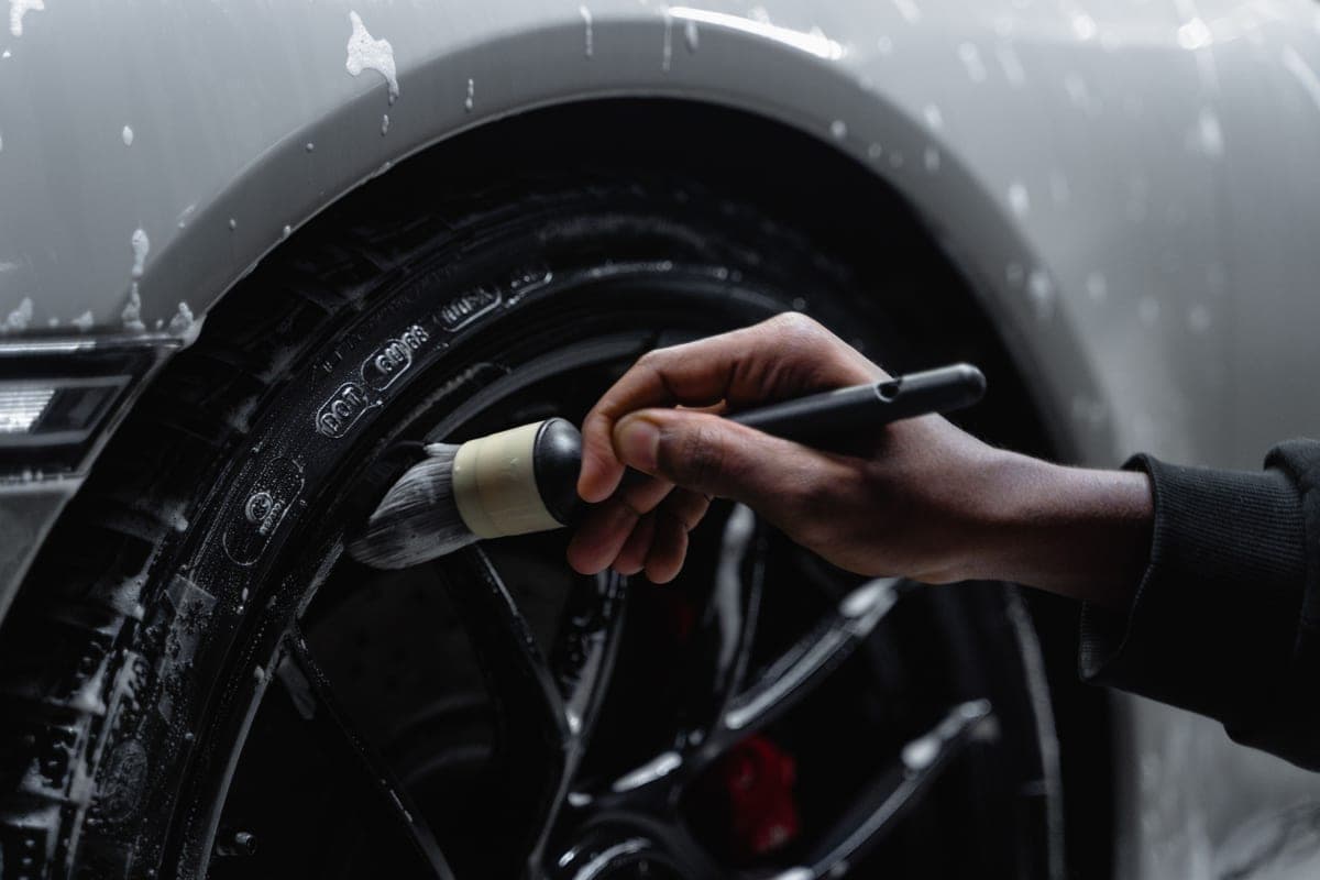 A wheel woolie cleaning between the spokes of an alloy wheel